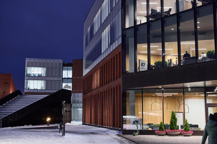 Lit building in the dark and snowy night 